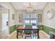 Cozy dining area featuring a chandelier, large window, and seating for four at 3964 Lochview Dr., Myrtle Beach, SC 29588