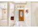 Bright foyer featuring white tile floors and a decorative wooden front door at 3964 Lochview Dr., Myrtle Beach, SC 29588