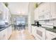 Charming kitchen featuring white cabinets, green countertops and a cozy dining area at 3964 Lochview Dr., Myrtle Beach, SC 29588