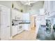 Well-lit kitchen featuring white cabinets, stainless steel appliances, and tile flooring at 3964 Lochview Dr., Myrtle Beach, SC 29588