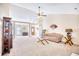 Spacious living room featuring vaulted ceiling with ceiling fan and cozy seating with bright, natural lighting at 3964 Lochview Dr., Myrtle Beach, SC 29588