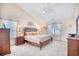 Serene main bedroom with vaulted ceilings, carpet floors, a ceiling fan, and an abundance of natural light at 3964 Lochview Dr., Myrtle Beach, SC 29588