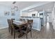 Dining area adjacent to the kitchen, featuring modern lighting, an open layout, and coastal decor at 4301 S Ocean Blvd. # 1-B, North Myrtle Beach, SC 29582