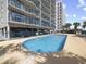 Beautiful outdoor pool area offers relaxation and recreation for residents with parking underneath at 4301 S Ocean Blvd. # 1-B, North Myrtle Beach, SC 29582