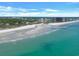 Stunning aerial view of a beach with turquoise water and a vibrant cityscape at 435 Ocean Creek Dr. # 2705, Myrtle Beach, SC 29572