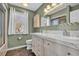 Bathroom featuring a double vanity, well-lit mirror, and neutral color palette at 435 Ocean Creek Dr. # 2705, Myrtle Beach, SC 29572