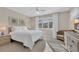 Bright bedroom with neutral tones, large windows and coastal inspired decor at 435 Ocean Creek Dr. # 2705, Myrtle Beach, SC 29572