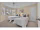 Bright bedroom featuring two twin beds with plush white comforters and coastal-inspired decor at 435 Ocean Creek Dr. # 2705, Myrtle Beach, SC 29572