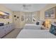 Bedroom with two twin beds, bay window, dresser, and coastal decor at 435 Ocean Creek Dr. # 2705, Myrtle Beach, SC 29572