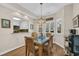 Inviting dining area with wood floors, plenty of natural light, and a view into the kitchen at 435 Ocean Creek Dr. # 2705, Myrtle Beach, SC 29572