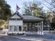 Community entrance gate house with American and South Carolina flags flying high at 435 Ocean Creek Dr. # 2705, Myrtle Beach, SC 29572