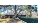 View of townhomes with lush landscaping and a covered bench, creating a community feel at 435 Ocean Creek Dr. # 2705, Myrtle Beach, SC 29572