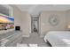 Hallway with beachy decor, leading to a Primary bedroom featuring a dresser and a queen size bed at 435 Ocean Creek Dr. # 2705, Myrtle Beach, SC 29572