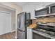 This stainless steel kitchen is equipped with modern appliances and granite countertops at 435 Ocean Creek Dr. # 2705, Myrtle Beach, SC 29572