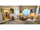 Spacious living room with large windows, comfortable sofas, and seamless transition to kitchen at 435 Ocean Creek Dr. # 2705, Myrtle Beach, SC 29572