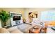 Cozy living area featuring a TV, decorative shelving, and staircase access at 435 Ocean Creek Dr. # 2705, Myrtle Beach, SC 29572