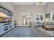 Bright living room with entertainment center, cozy sofa, and stylish rug at 435 Ocean Creek Dr. # 2705, Myrtle Beach, SC 29572