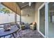 Cozy screened in patio with comfortable seating, perfect for relaxing and entertaining outdoors at 435 Ocean Creek Dr. # 2705, Myrtle Beach, SC 29572