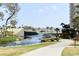 Scenic waterfront view featuring a stream, walkway, and glimpses of the ocean and beachfront buildings at 435 Ocean Creek Dr. # 2705, Myrtle Beach, SC 29572