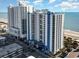 Coastal condo resort showcasing modern architecture, ocean views, and well-maintained landscaping at 504 N Ocean Blvd. # 701, Myrtle Beach, SC 29577