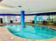 Inviting indoor pool area with blue accents, tiled surround, and ample space for relaxation at 504 N Ocean Blvd. # 701, Myrtle Beach, SC 29577