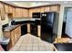 Efficient kitchen equipped with black appliances and ample cabinet space for storage and meal preparation at 504 N Ocean Blvd. # 701, Myrtle Beach, SC 29577