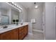 Bathroom featuring a double sink vanity with generous lighting, mirror, and a neutral color palette at 517 Poppi Point Ct. # 517, Myrtle Beach, SC 29579