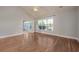 Bright bedroom with hardwood flooring, a ceiling fan, and a screened-in porch through the glass patio doors at 517 Poppi Point Ct. # 517, Myrtle Beach, SC 29579