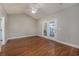 Bedroom boasts hardwood flooring, a ceiling fan, and glass patio doors that lead to a screened-in porch at 517 Poppi Point Ct. # 517, Myrtle Beach, SC 29579