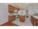 Well-lit kitchen features oak cabinets, a kitchen island, and sleek appliances at 517 Poppi Point Ct. # 517, Myrtle Beach, SC 29579