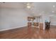 Open-concept living area features hardwood floors and seamlessly connects to the kitchen with a bar counter at 517 Poppi Point Ct. # 517, Myrtle Beach, SC 29579