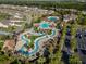 Overhead view of a lazy river and community pool with homes in the background at 517 Poppi Point Ct. # 517, Myrtle Beach, SC 29579