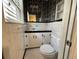 Classic bathroom with white tiles, black accents, and vintage fixtures at 57 Tallahassee Rd., Georgetown, SC 29440