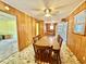 Charming dining room with wood-paneled walls, vintage-style flooring, and an inviting wooden table set at 57 Tallahassee Rd., Georgetown, SC 29440