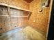 Unfinished room with plywood walls, concrete floor and built in shelving at 57 Tallahassee Rd., Georgetown, SC 29440