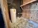 Practical utility room with a water heater and shelving at 57 Tallahassee Rd., Georgetown, SC 29440