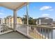 Balcony with a white railing overlooking the lake, surrounding buildings, and blue skies at 601 N Hillside Dr. # 2331, North Myrtle Beach, SC 29582