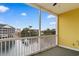 Balcony view of nearby condos, lake, water tower, and bright blue sky at 601 N Hillside Dr. # 2331, North Myrtle Beach, SC 29582