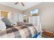 Bedroom with an ensuite bathroom, a ceiling fan, and a mounted television atop a white dresser at 601 N Hillside Dr. # 2331, North Myrtle Beach, SC 29582