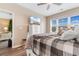 Bedroom with an ensuite bathroom, a ceiling fan, and a well-lit window with blinds at 601 N Hillside Dr. # 2331, North Myrtle Beach, SC 29582