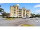 Exterior view of a condo building with multiple floors, balconies, and ample parking spaces at 601 N Hillside Dr. # 2331, North Myrtle Beach, SC 29582