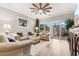 Cozy living room featuring a plush sofa, armchair, ceiling fan, and sliding glass doors at 601 N Hillside Dr. # 2331, North Myrtle Beach, SC 29582