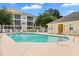 Community pool with nearby lounge chairs and yellow condominium buildings at 601 N Hillside Dr. # 2331, North Myrtle Beach, SC 29582