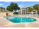 Community pool with nearby lounge chairs and yellow condominium buildings at 601 N Hillside Dr. # 2331, North Myrtle Beach, SC 29582