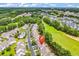 Overhead shot of condos nestled along a golf course with mature trees at 6095 Catalina Dr. # 1614, North Myrtle Beach, SC 29582