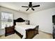 A bedroom features a large bed, a dresser, and great natural light at 6095 Catalina Dr. # 1614, North Myrtle Beach, SC 29582