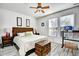 Spacious bedroom offers a ceiling fan, a large bed with a trunk, and great natural light at 6095 Catalina Dr. # 1614, North Myrtle Beach, SC 29582