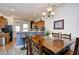 Cozy dining area with chandelier and wooden table at 6095 Catalina Dr. # 1614, North Myrtle Beach, SC 29582