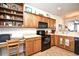 Well-lit kitchen featuring a built-in desk area and overhead storage at 6095 Catalina Dr. # 1614, North Myrtle Beach, SC 29582