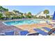Inviting community pool with plenty of lounge chairs and shade umbrellas at 6095 Catalina Dr. # 1614, North Myrtle Beach, SC 29582